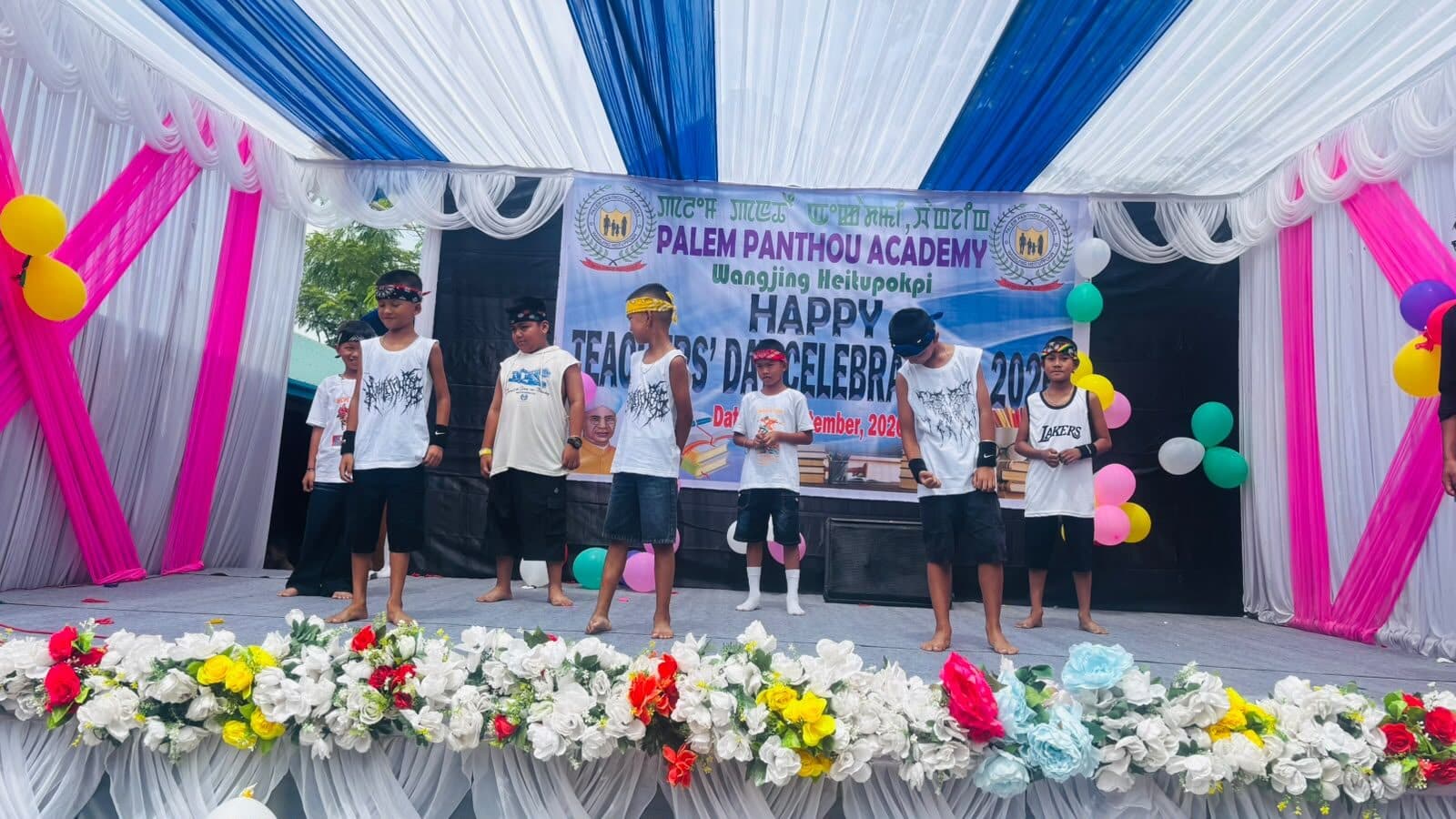 Students performing on stage at the Teachers' Day celebration