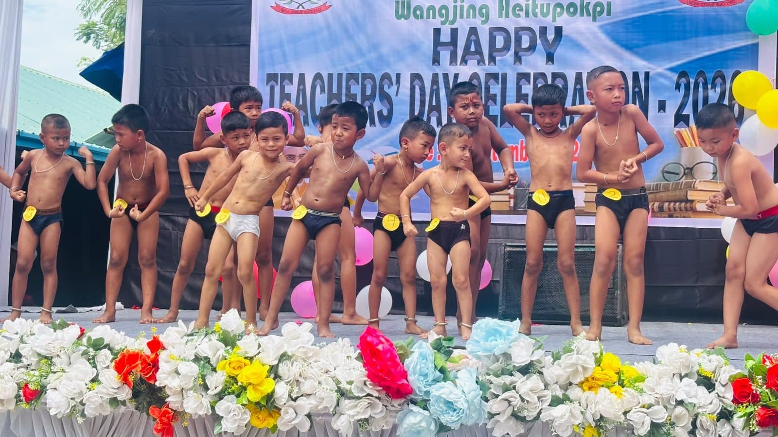Young performers taking their places for a Teachers' Day item